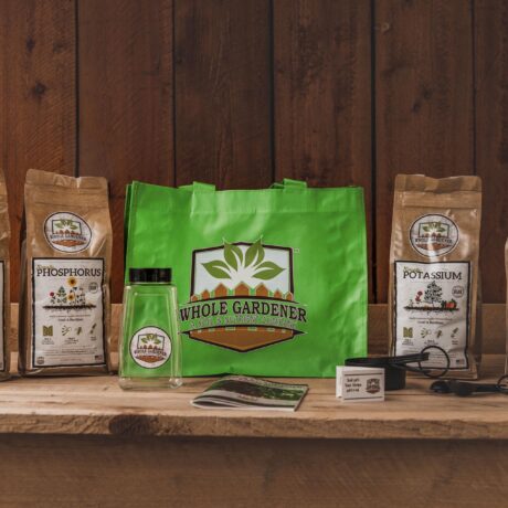 organic plant nutrient starter pack on gardening workbench with green carry bag