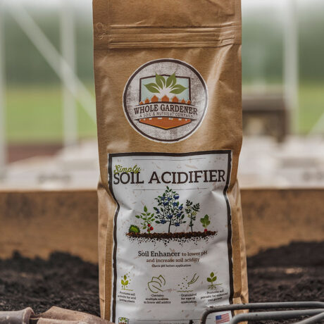 bag of soil acidifier with garden trowel in the garden soil